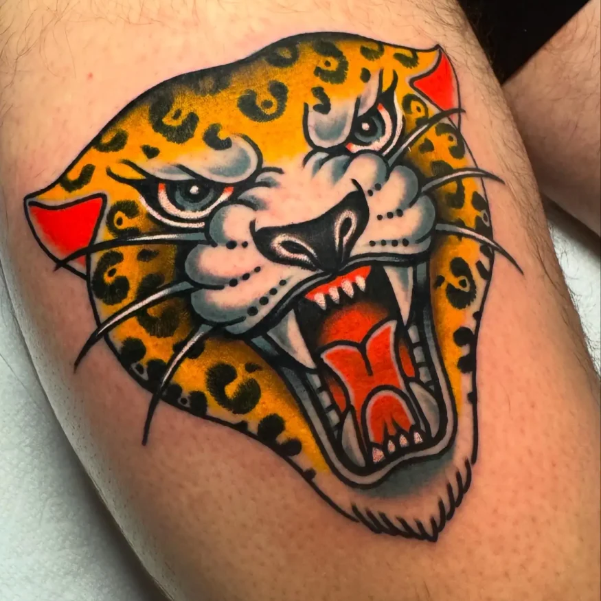 Jaguar thigh tattoo